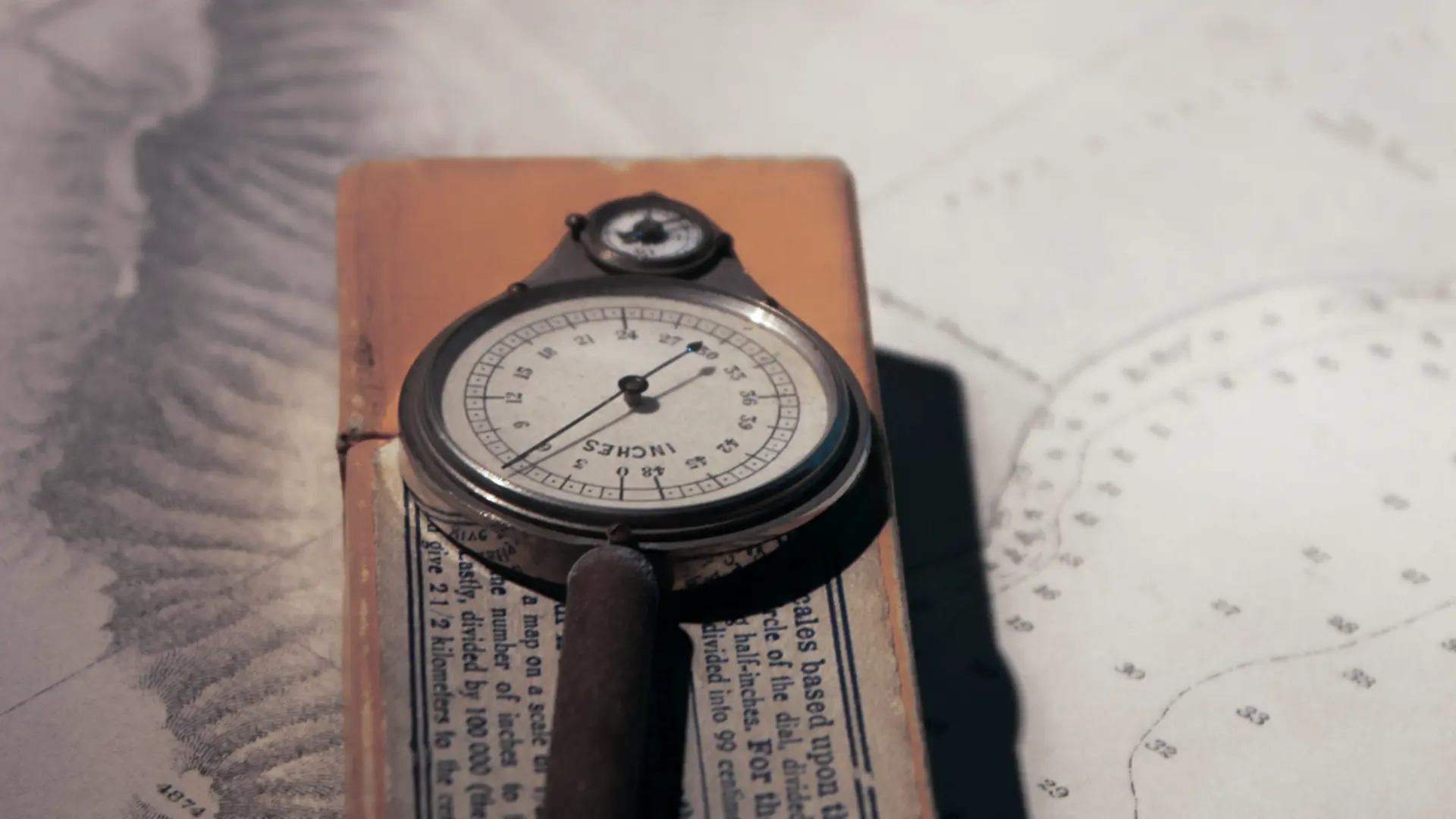 A vintage brass map measurer and compass resting on a nautical chart, symbolizing precision diagnostics and business direction.
